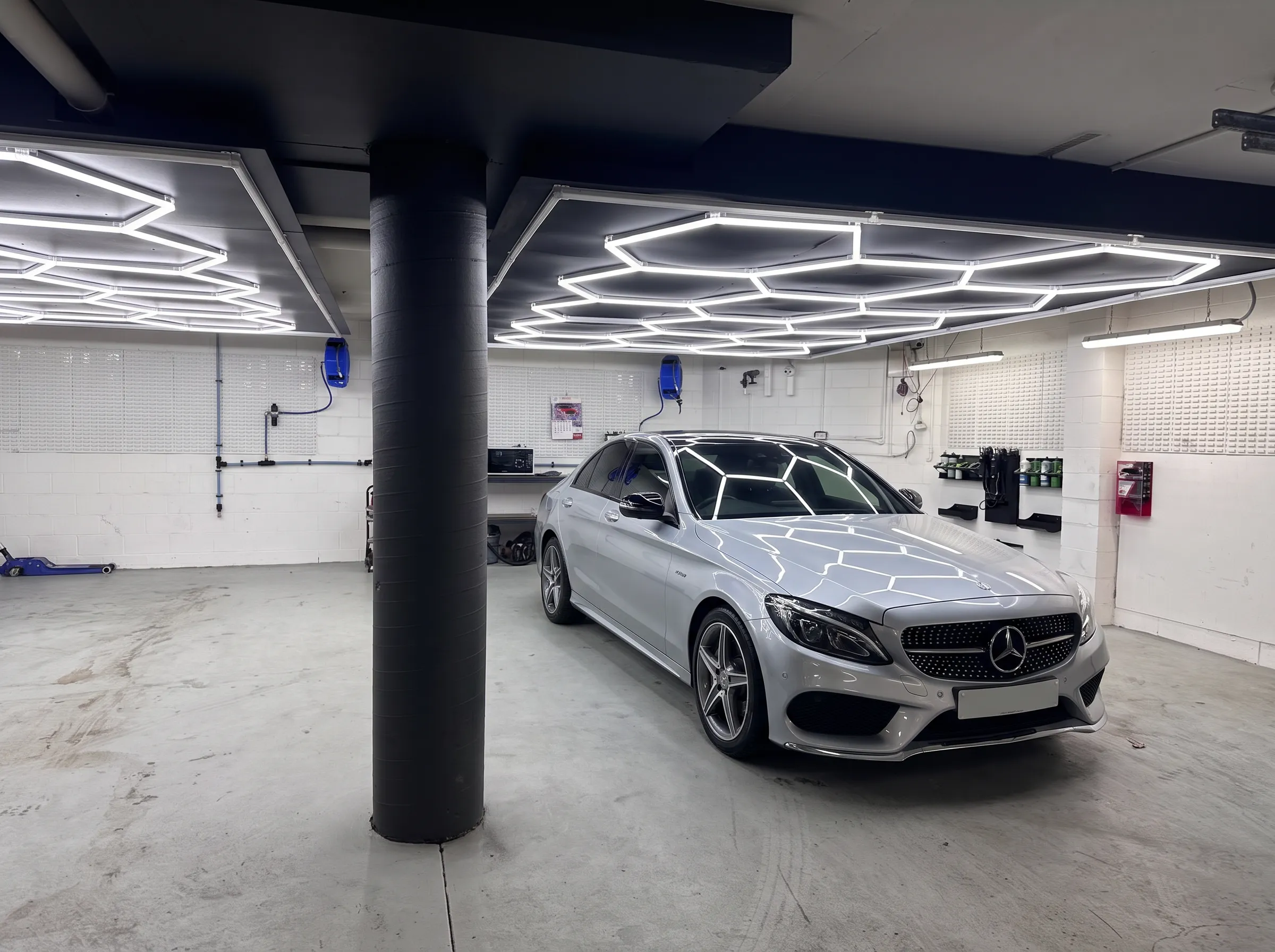 Mercedes-AMG under the hex lighting at our West Ryde detailing workshop
