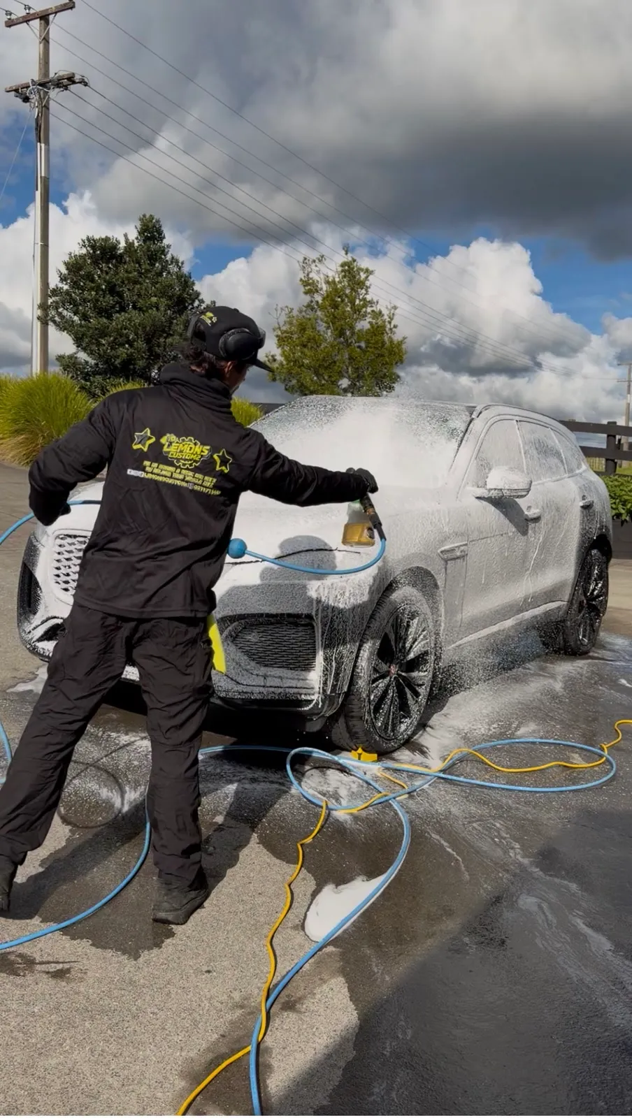 Pre-wash foam going onto a Jaguar F-Pace